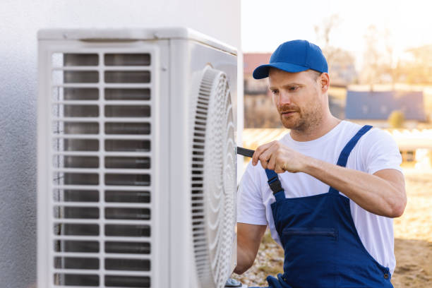 HVAC technician servicing an outdoor air conditioner in Pasadena